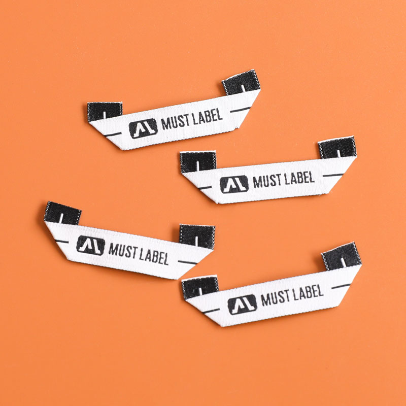 Welke stof wordt gebruikt voor geweven labels?